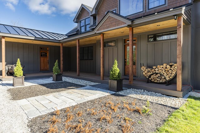 100 Morganite Way, Newry, ME 04261 - view of exterior entry with covered porch, a standing seam roof, board and batten siding, and metal roof
