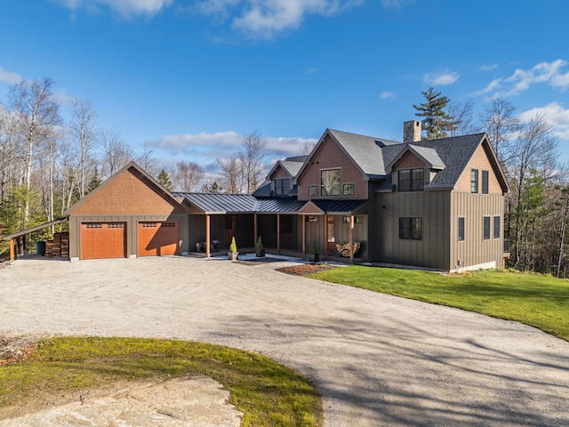 view of front of house featuring a front yard and a garage