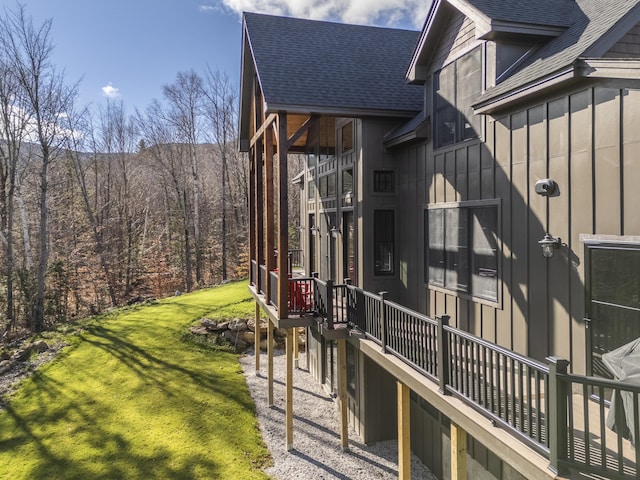 100 Morganite Way, Newry, ME 04261 - view of property exterior featuring a shingled roof, a lawn, board and batten siding, and a wooded view