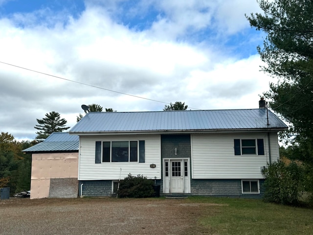 bi-level home with a front yard