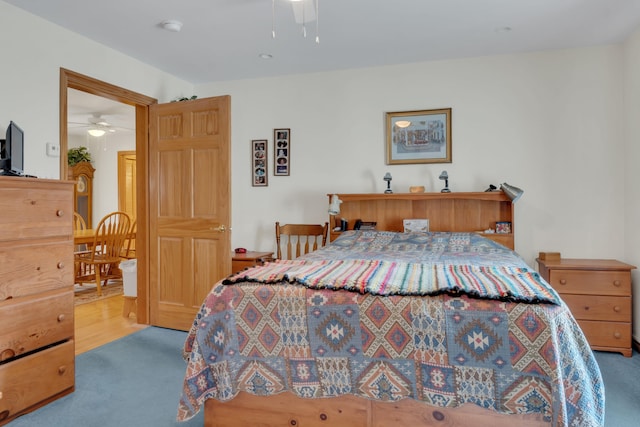 carpeted bedroom with ceiling fan