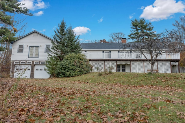 view of side of property with a yard and a garage