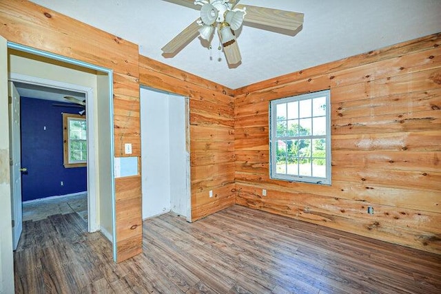 unfurnished room with hardwood / wood-style floors and ceiling fan