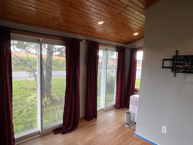 752 Caribou Rd, Fort Kent, ME 04743 - entryway with a healthy amount of sunlight, wooden ceiling, and light hardwood / wood-style flooring