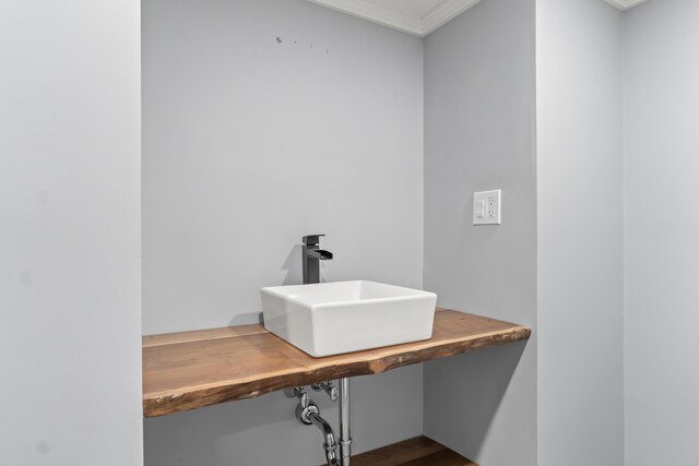 107 Lindsay Rd, York, ME 03909 - unfurnished office featuring a sink, ornamental molding, built in study area, and dark wood-style floors