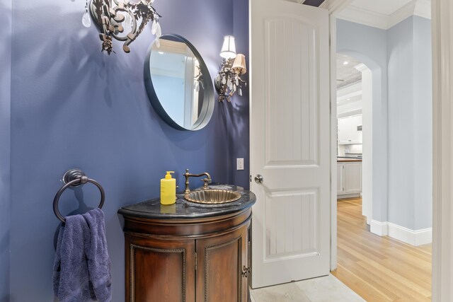107 Lindsay Rd, York, ME 03909 - bathroom with wood finished floors, vanity, and crown molding