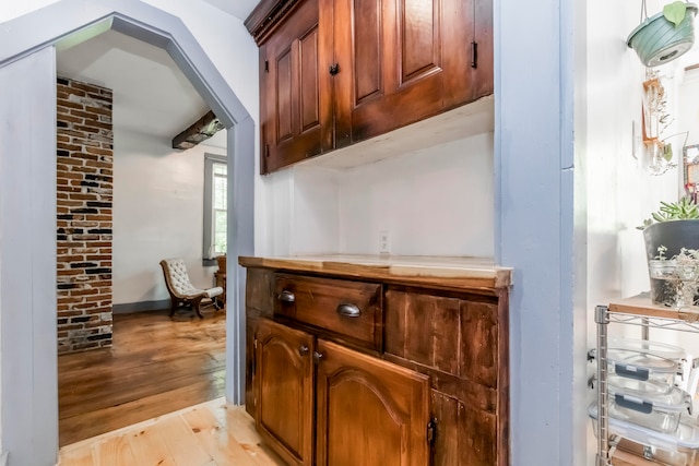 bar featuring light hardwood / wood-style flooring