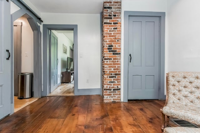 hallway with wood-type flooring