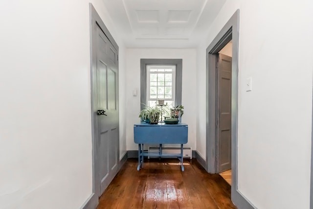 entryway featuring dark wood-type flooring and a baseboard radiator