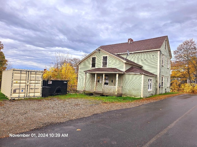 view of property with a porch