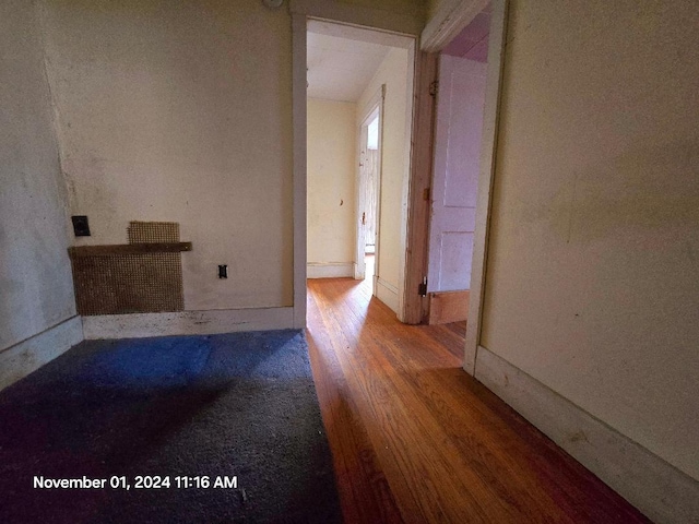 spare room with hardwood / wood-style flooring