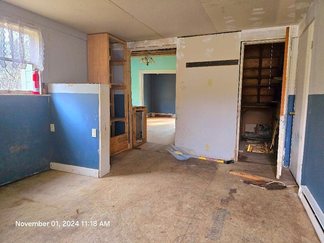 interior space featuring a closet and baseboard heating