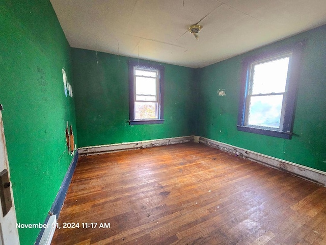 spare room featuring hardwood / wood-style flooring