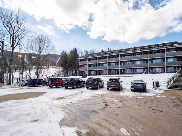 view of snow covered parking