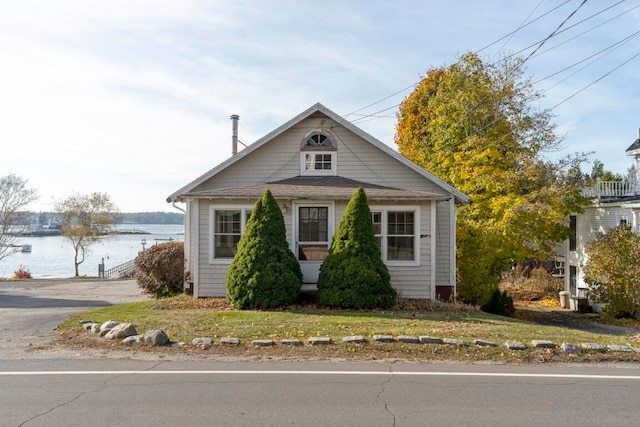 bungalow-style house featuring a water view