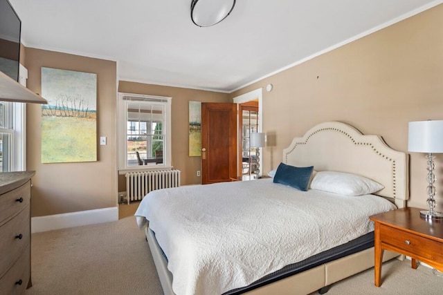 carpeted bedroom featuring radiator heating unit and crown molding