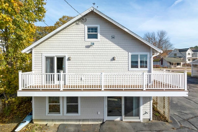 rear view of house with a patio and a wooden deck