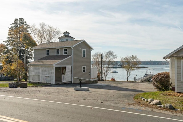 view of front facade featuring a water view