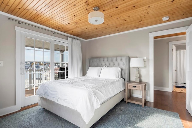 bedroom featuring access to exterior, multiple windows, dark hardwood / wood-style flooring, and crown molding