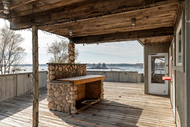 wooden deck featuring a water view