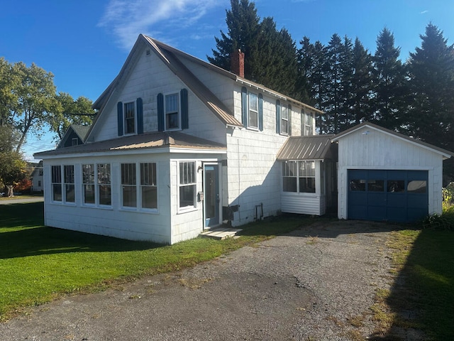 view of home's exterior with a yard and a garage