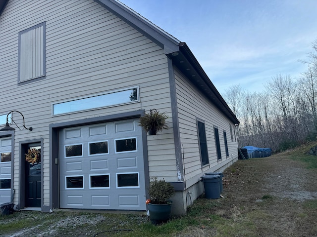 view of side of property with a garage