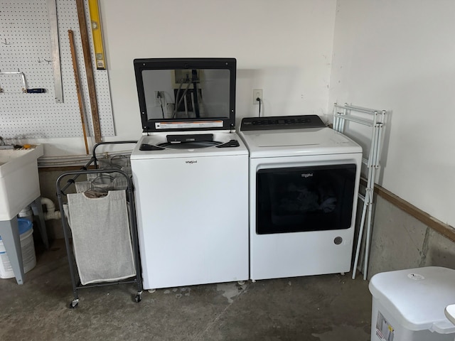 clothes washing area with independent washer and dryer