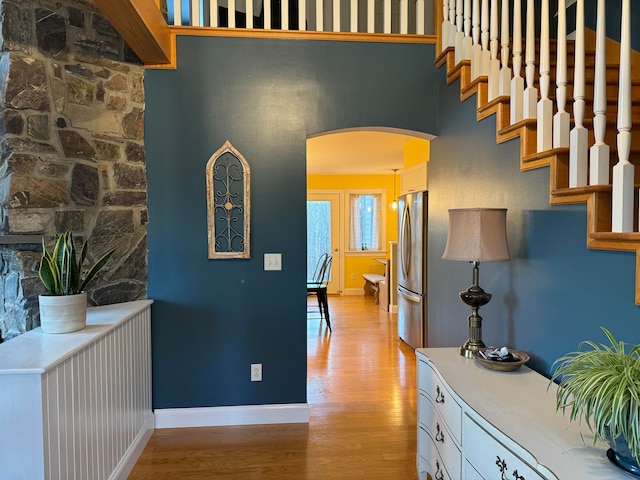 hallway with light hardwood / wood-style flooring