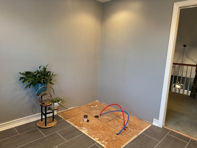 interior space featuring dark tile patterned flooring