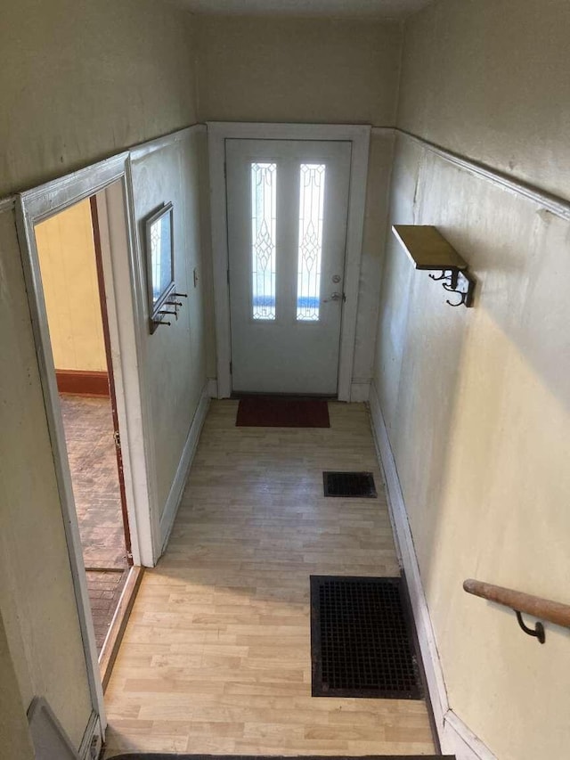 entryway with light hardwood / wood-style flooring