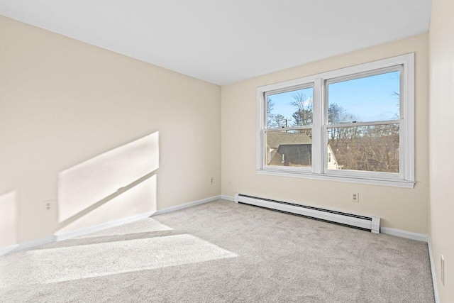 carpeted empty room with baseboard heating