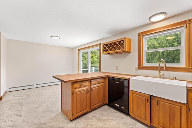 221 Frost Rd, Lyman, ME 04002 - kitchen with dishwasher, a baseboard heating unit, a peninsula, brown cabinetry, and wood counters
