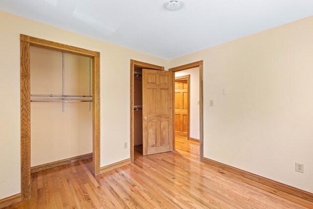 221 Frost Rd, Lyman, ME 04002 - unfurnished bedroom featuring light wood-type flooring and a closet