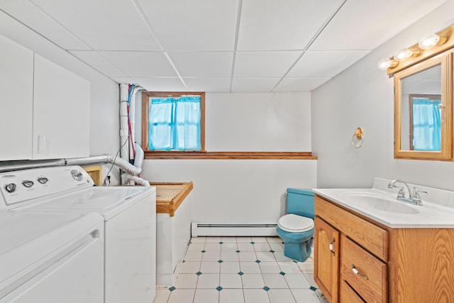 221 Frost Rd, Lyman, ME 04002 - bathroom featuring a baseboard heating unit, separate washer and dryer, vanity, and a drop ceiling