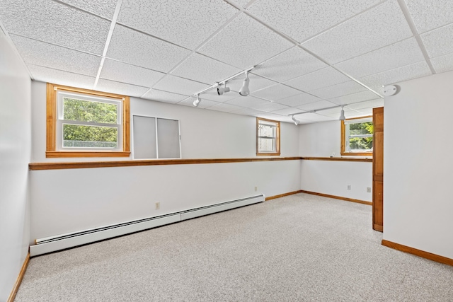 221 Frost Rd, Lyman, ME 04002 - basement with a baseboard heating unit, carpet floors, rail lighting, and a drop ceiling