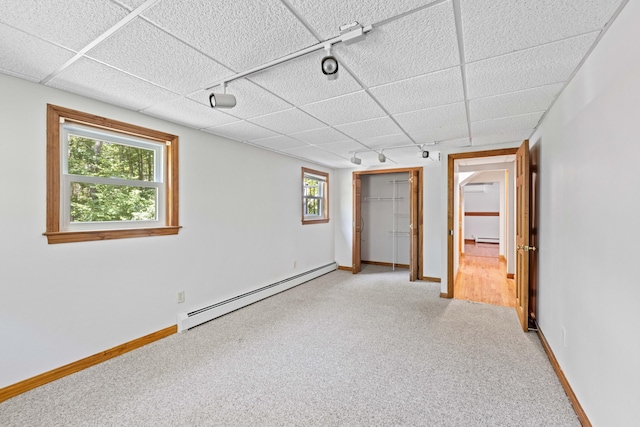 221 Frost Rd, Lyman, ME 04002 - unfurnished bedroom with a baseboard radiator, carpet flooring, track lighting, a closet, and a baseboard heating unit