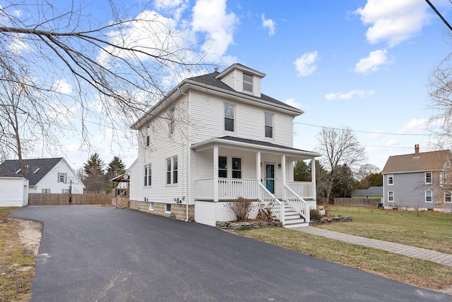 view of front of home with a porch and a front lawn