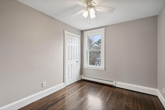 empty room featuring a baseboard radiator, ceiling fan, and dark wood-type flooring