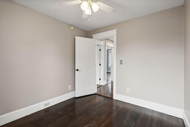 empty room with hardwood / wood-style flooring and ceiling fan