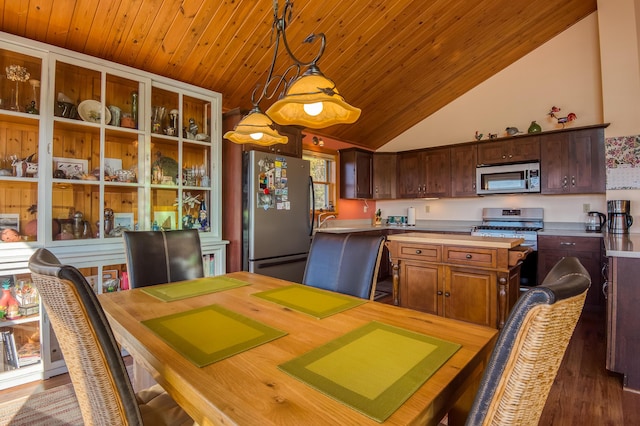 58 Wheeler Hill Rd, Phillips, ME 04966 - kitchen with appliances with stainless steel finishes, light countertops, a kitchen island, dark wood finished floors, and vaulted ceiling