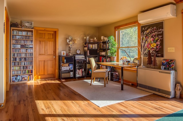 58 Wheeler Hill Rd, Phillips, ME 04966 - office with a wall mounted AC and wood finished floors