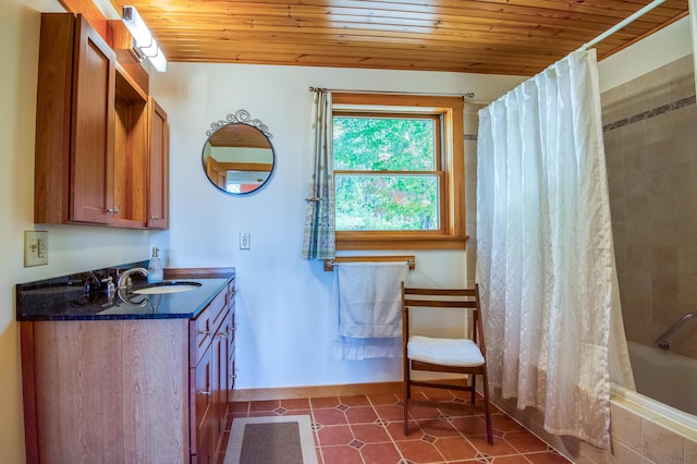 58 Wheeler Hill Rd, Phillips, ME 04966 - full bath with wood ceiling, tiled shower / bath combo, baseboards, and vanity
