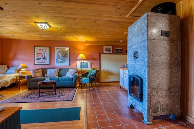 58 Wheeler Hill Rd, Phillips, ME 04966 - living room featuring wood ceiling and a tiled fireplace