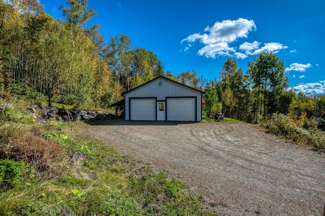 58 Wheeler Hill Rd, Phillips, ME 04966 - detached garage with a forest view