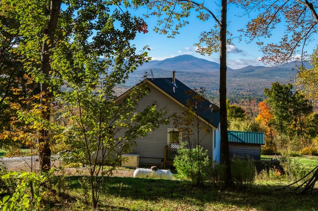 58 Wheeler Hill Rd, Phillips, ME 04966 - view of home's exterior with a mountain view