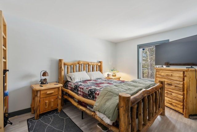 bedroom with wood finished floors