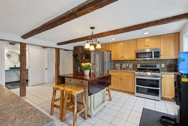 kitchen with decorative backsplash, light tile patterned flooring, stainless steel appliances, and a textured ceiling