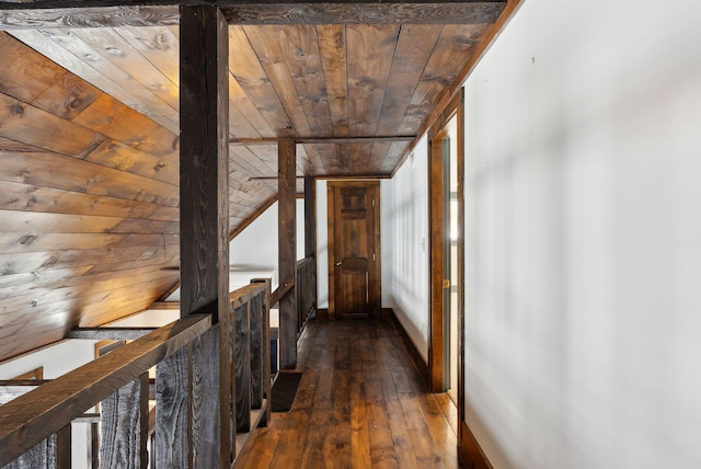 corridor featuring wooden ceiling, vaulted ceiling, an upstairs landing, and hardwood / wood-style flooring