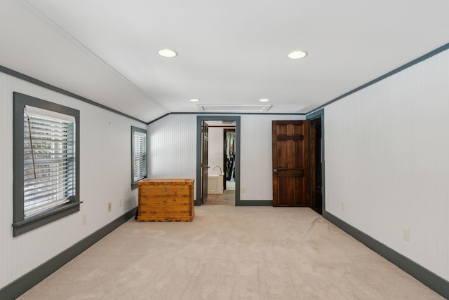 unfurnished bedroom featuring attic access, carpet flooring, recessed lighting, and a closet