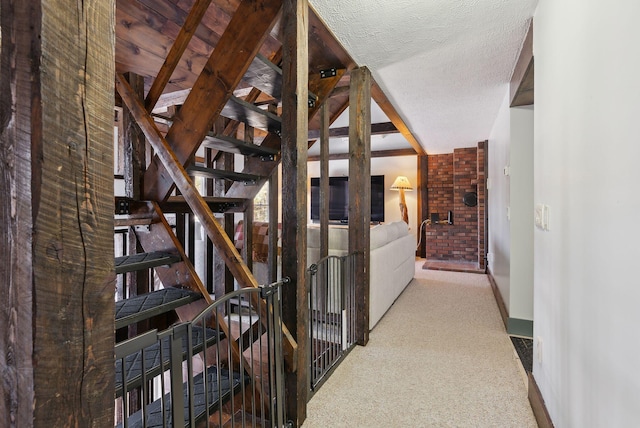 hall with baseboards and carpet